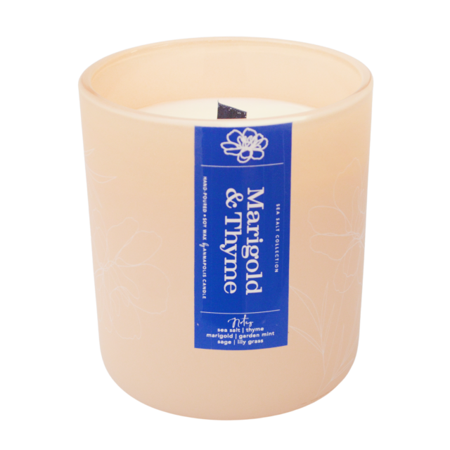 Annapolis Candle Marigold & Thyme Signature Wooden Wick Candle featuring a 15oz soy wax candle with a wooden wick and a refreshing marigold and thyme scent, available at Be Charmed