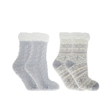 Two pairs of socks, one gray with cable knit pattern and white cuff, the other white with patterned design and gray cuff, on a white background. Available at Be Charmed. 
