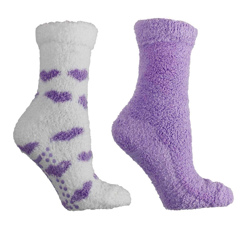 Pair of fuzzy socks with purple hearts on a white background. Available at Be Charmed. 