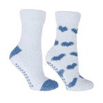 White fuzzy socks with blue heart patterns on a white background. Available at Be Charmed. 