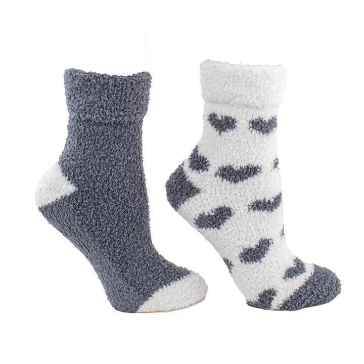 Two pairs of fuzzy socks, one gray and one with heart pattern on white background. Available at Be Charmed. 