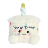 Aurora Palm Pal Happy B'day Cake 5-inch plush with white icing, rainbow sprinkles, smiling face, and plush candle. Perfect birthday gift plush. Available at Be Charmed.