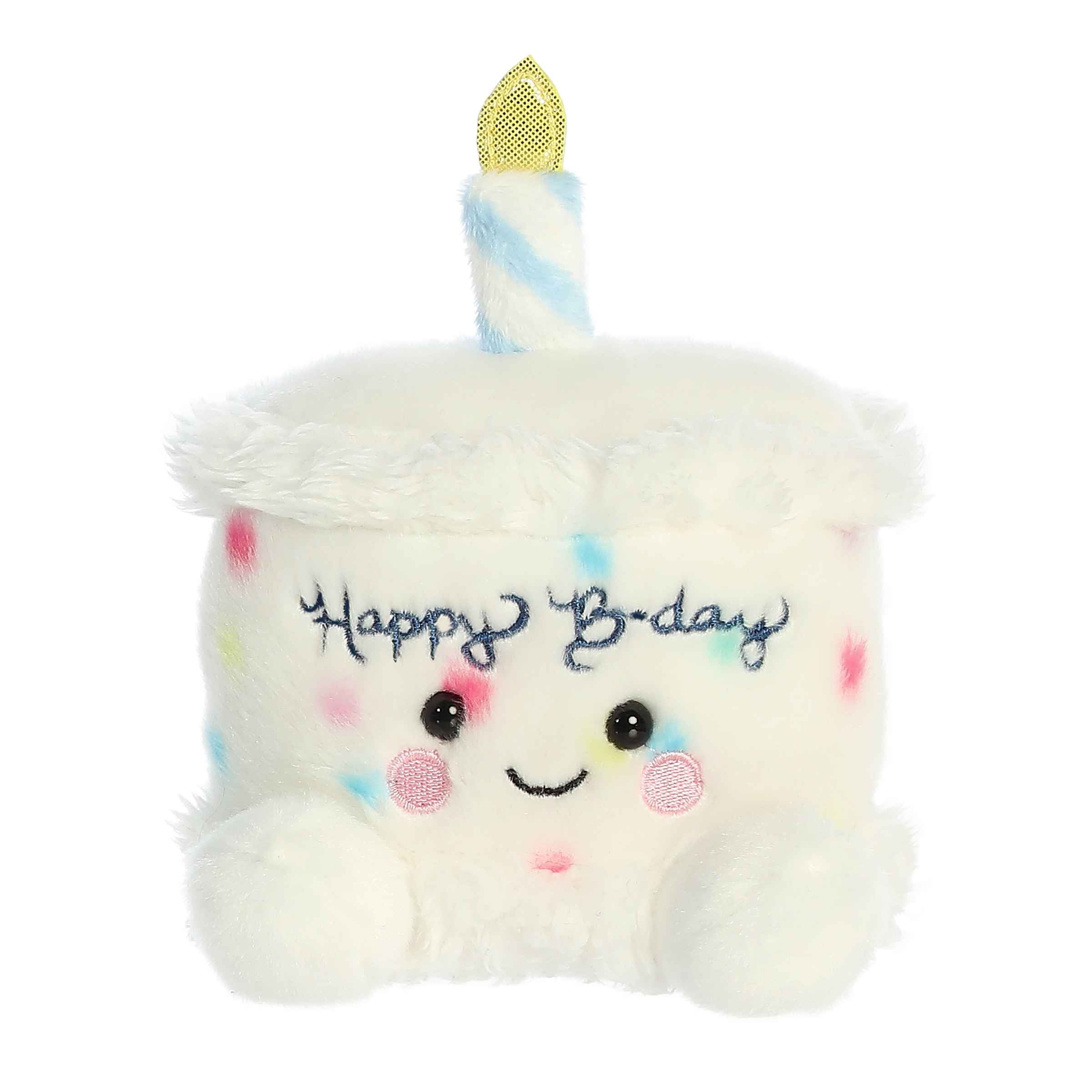 Aurora Palm Pal Happy B'day Cake 5-inch plush with white icing, rainbow sprinkles, smiling face, and plush candle. Perfect birthday gift plush. Available at Be Charmed.
