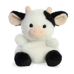 Aurora Palm Pal 5" Sweetie Cow plush with soft black and white fur, pink cheeks, and a bean-filled body. Adorable palm-sized cow toy. Available at Be Charmed.