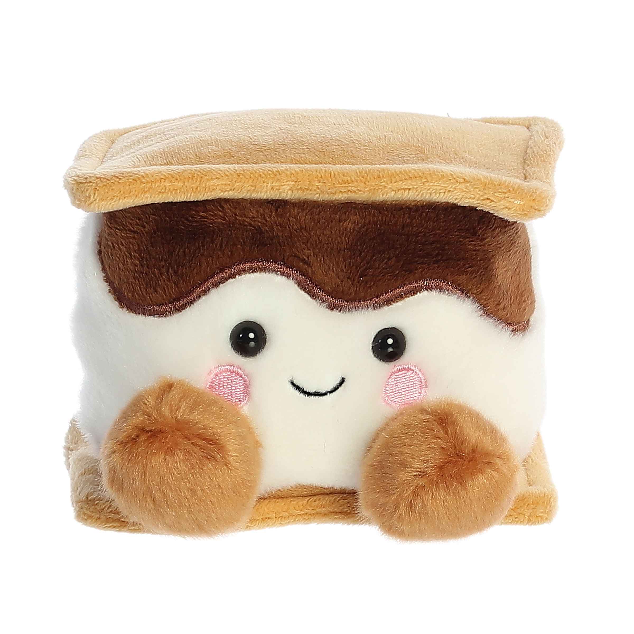 : Aurora Palm Pal Toastee S’more 5-inch plush toy with smiling marshmallow face, soft graham cracker and chocolate layers. Adorable plush treat. Available at Be Charmed.