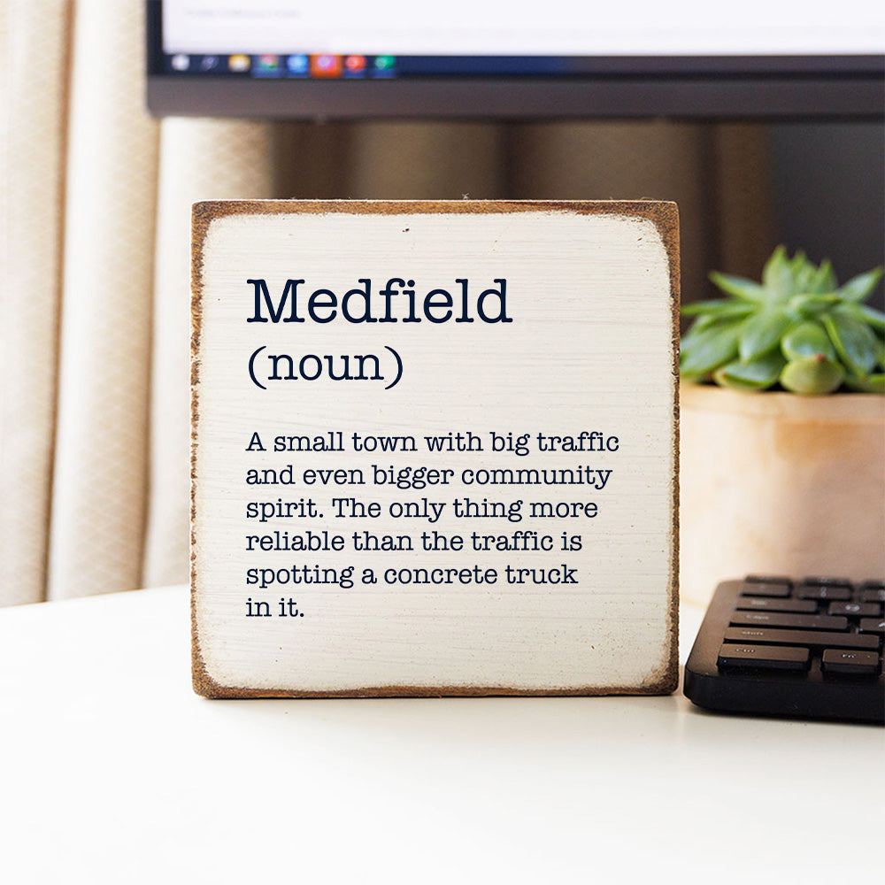 Rustic Marlin Medfield Humor Definition Wood Block pictured on a desk