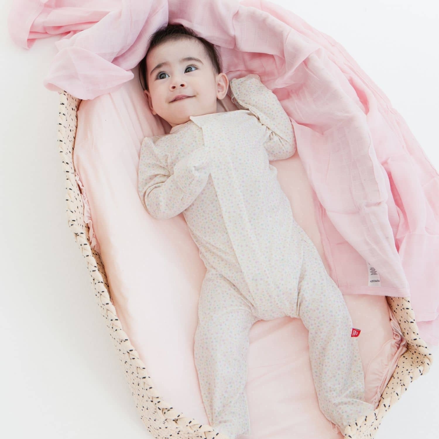 Baby wearing Magnetic Me Bedford Floral Modal Footie – Soft modal footie with floral print, featuring magnetic closures for easy dressing, available at Be Charmed.