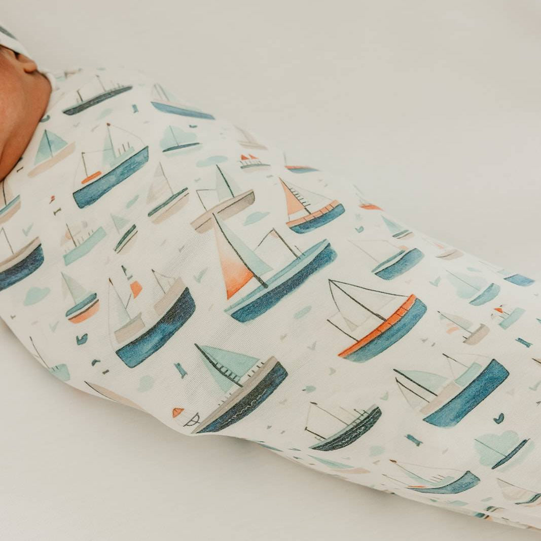 Baby swaddled in Copper Pearl Fischer Knit Swaddle Blanket – Soft, breathable, and perfect for newborns to toddlers. Available at Be Charmed.