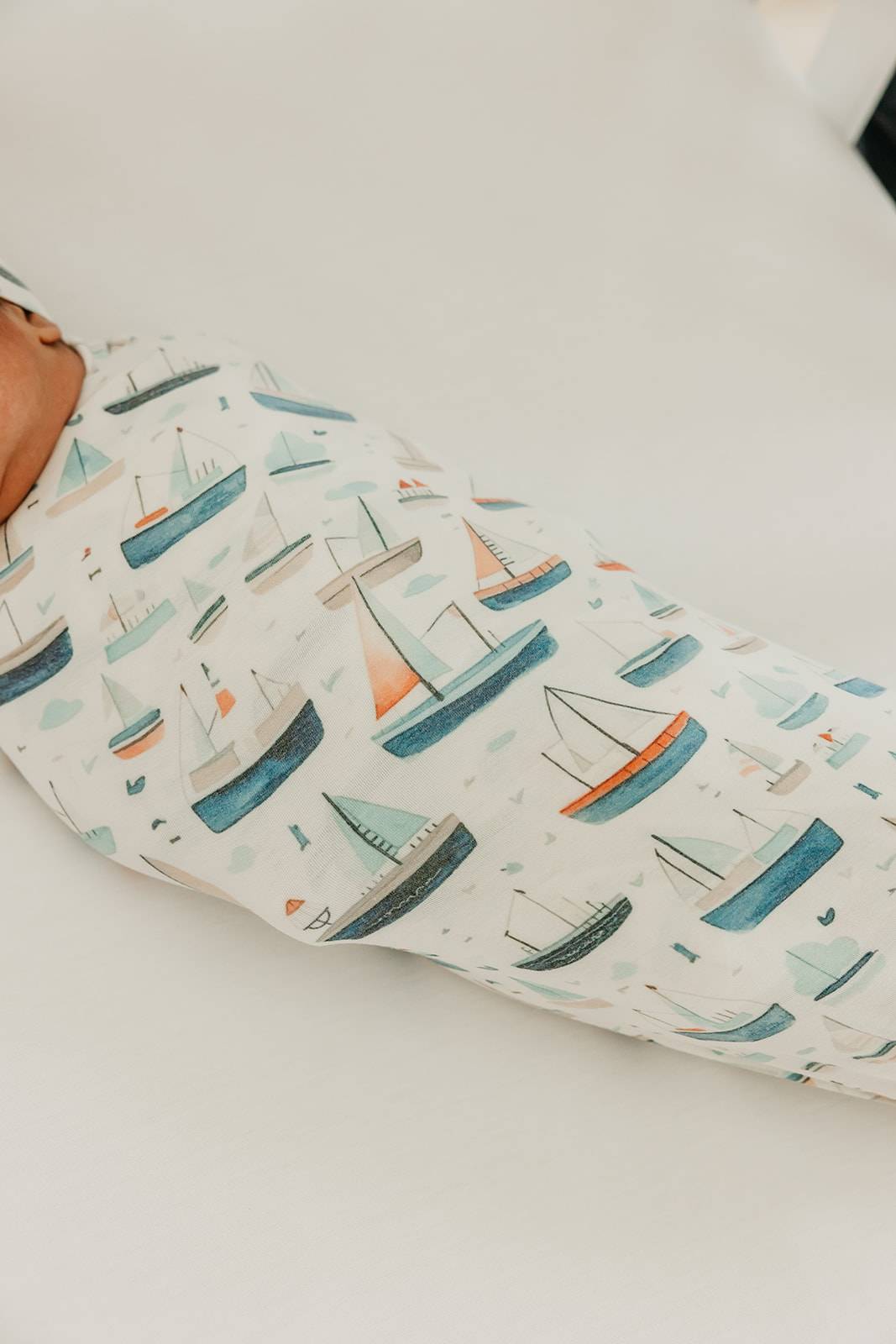 Baby swaddled in Copper Pearl Fischer Knit Swaddle Blanket – Soft, breathable, and perfect for newborns to toddlers. Available at Be Charmed.