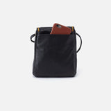 Black leather HOBO bag with a brown phone case on a white background. Available at Be Charmed
