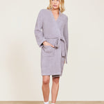 Woman in a Barefoot Dreams Cozychic Solid Robe Beach Rock