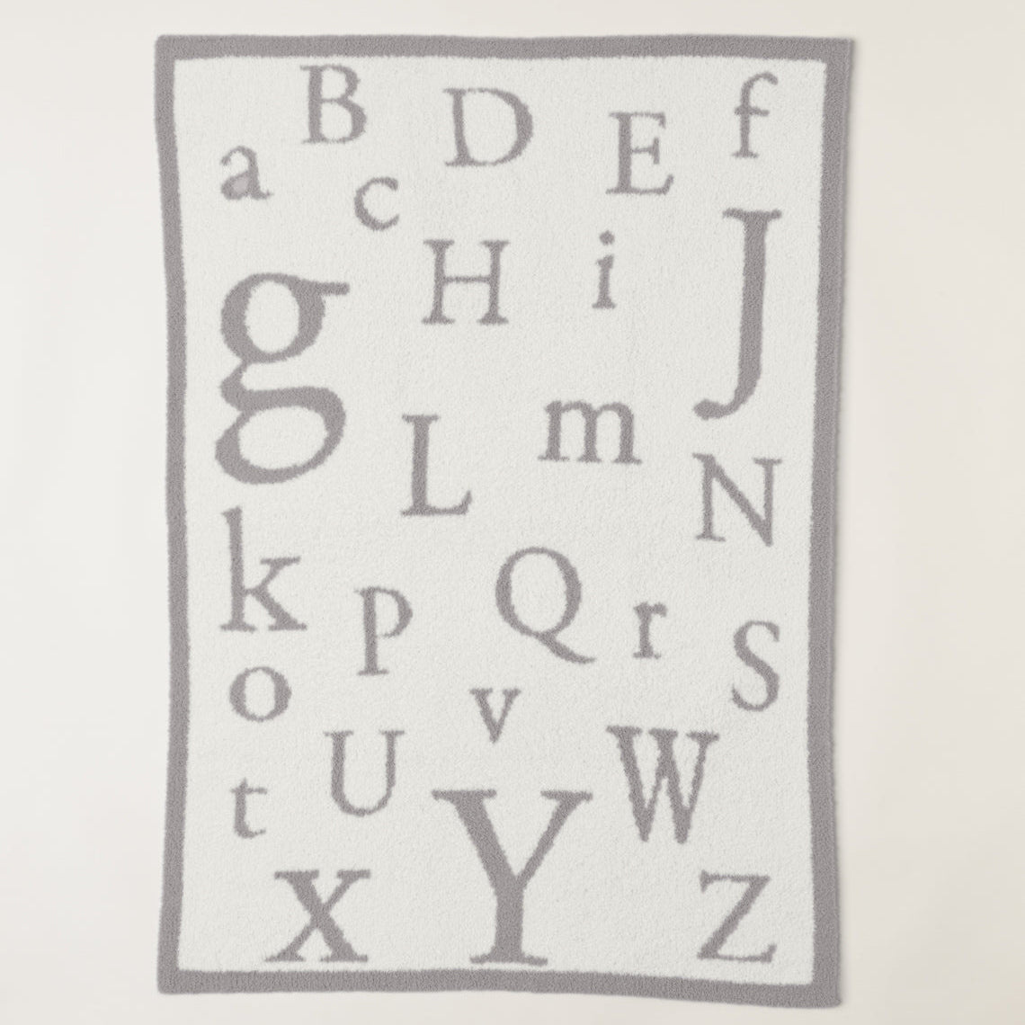 CozyChic ABC Blanket in Oyster/Cream by Barefoot Dreams, ultra-soft alphabet-print baby blanket, available at Be Charmed