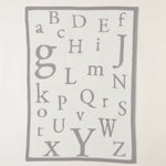 CozyChic ABC Blanket in Oyster/Cream by Barefoot Dreams, ultra-soft alphabet-print baby blanket, available at Be Charmed