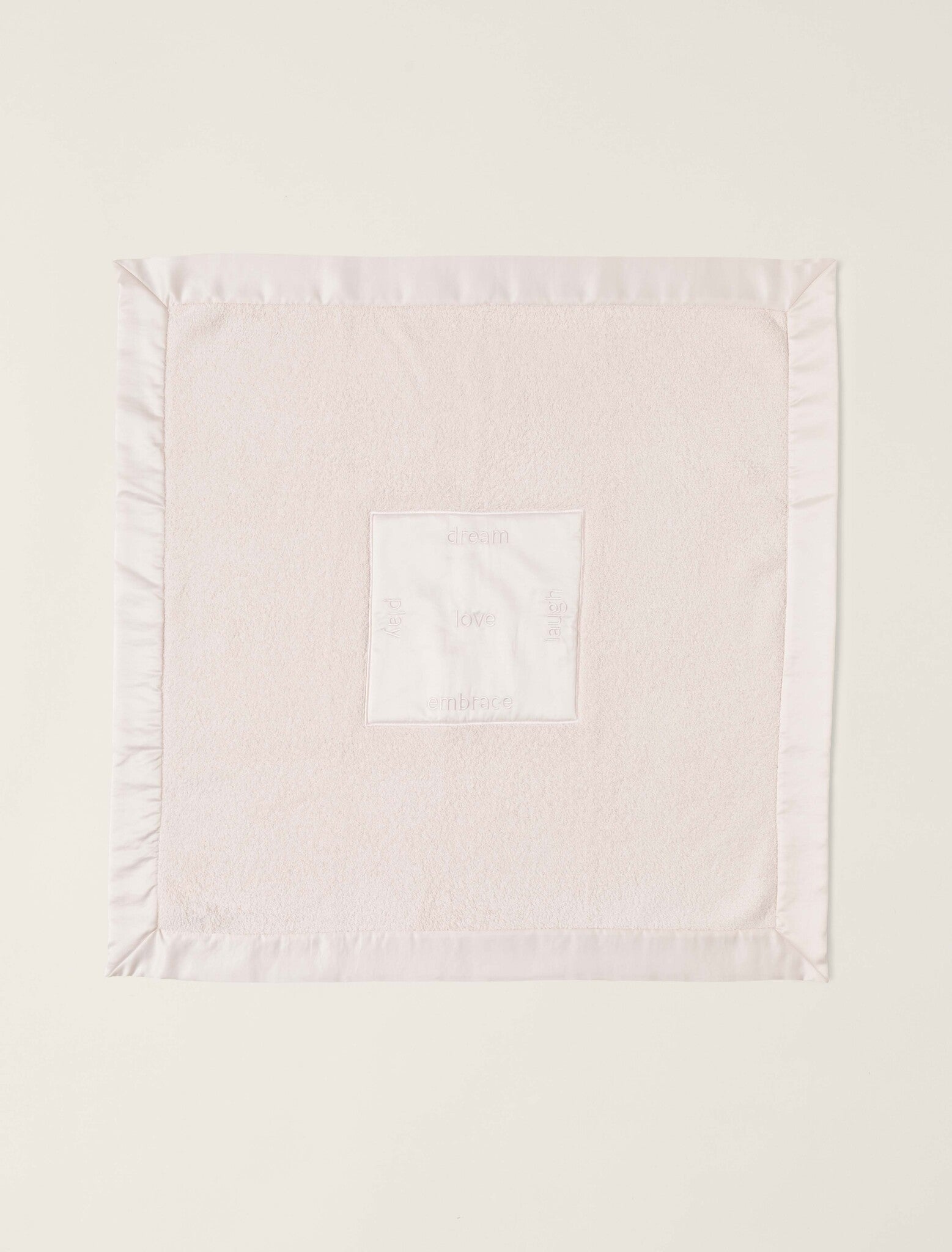 Opened Pink CozyChic Satin Trim Receiving Blanket in plush microfiber with satin border and embroidered center, available at Be Charmed.