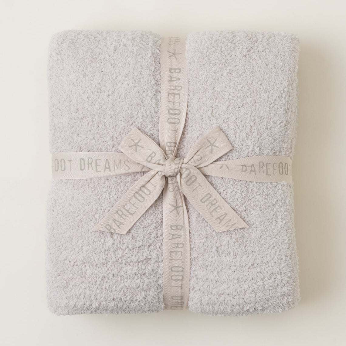 Barefoot Dreams CozyChic Stone Throw — ultra-soft, breathable luxury blanket for home or gifting. Available at Be Charmed