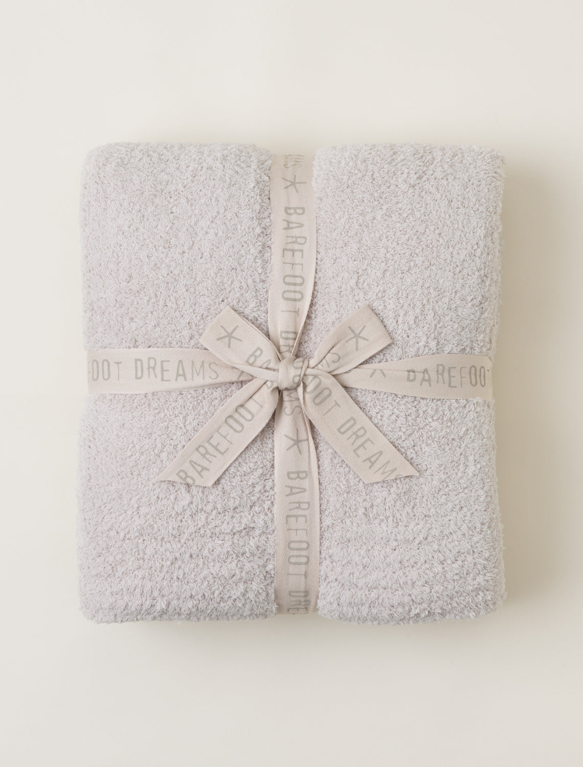 Barefoot Dreams CozyChic Stone Throw — ultra-soft, breathable luxury blanket for home or gifting. Available at Be Charmed