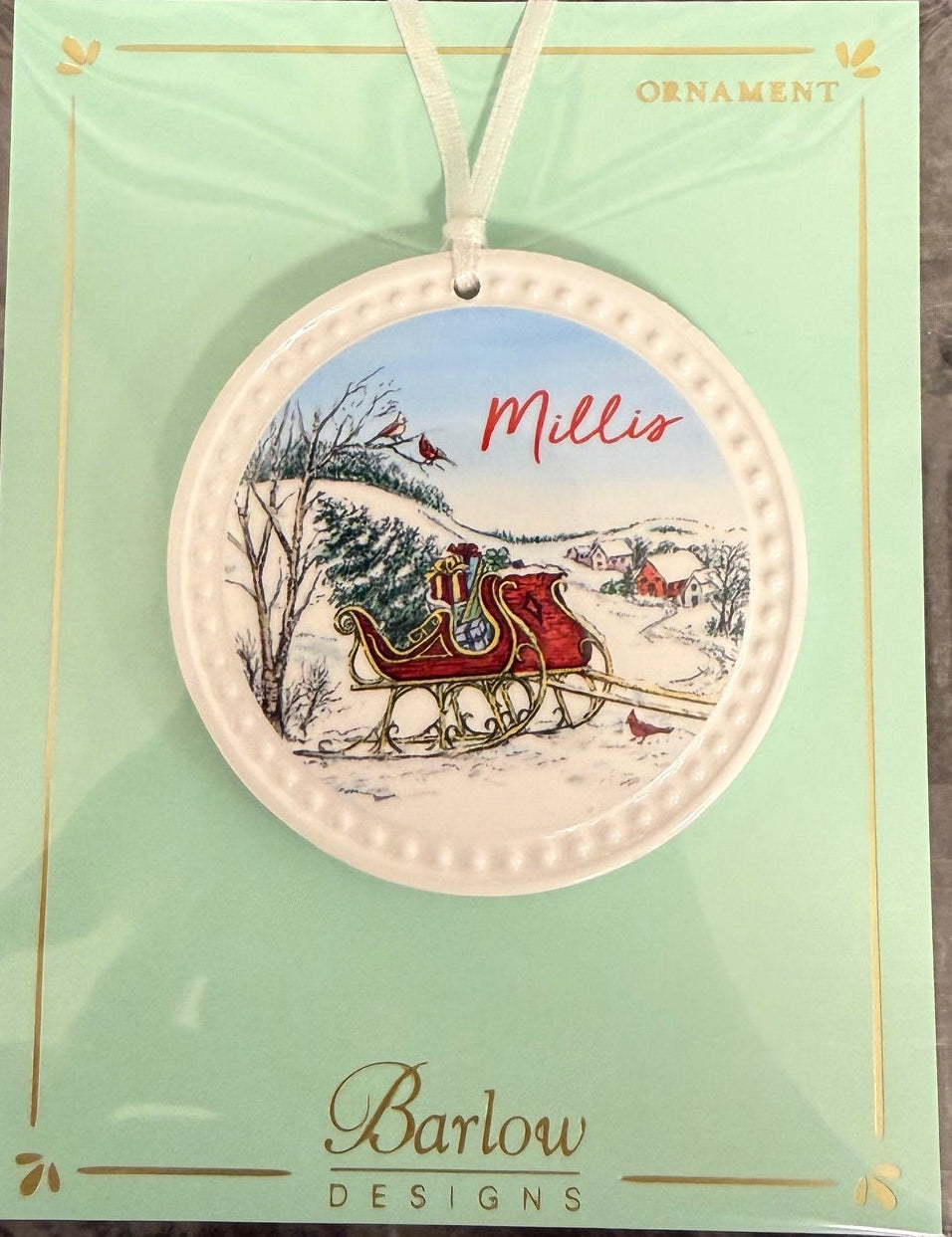 Millis Barlow Christmas Sleigh Towns Ornament – handcrafted holiday decoration for Christmas trees or gifting, available at Be Charmed.