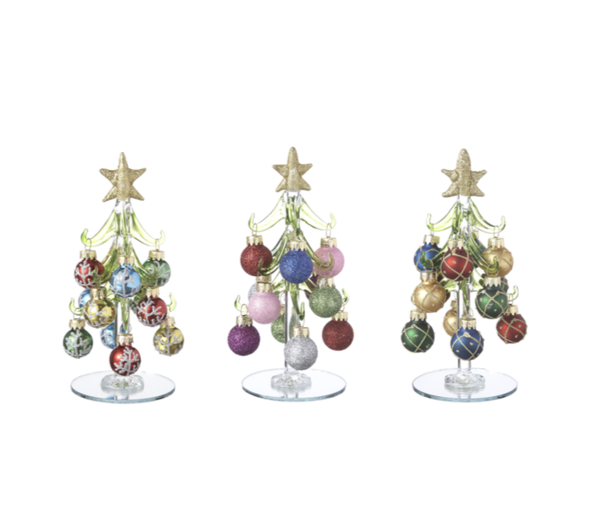 Three decorative Christmas trees with colorful ornaments on a white background. Available at Be Charmed