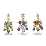 Three decorative Christmas trees with colorful ornaments on a white background. Available at Be Charmed