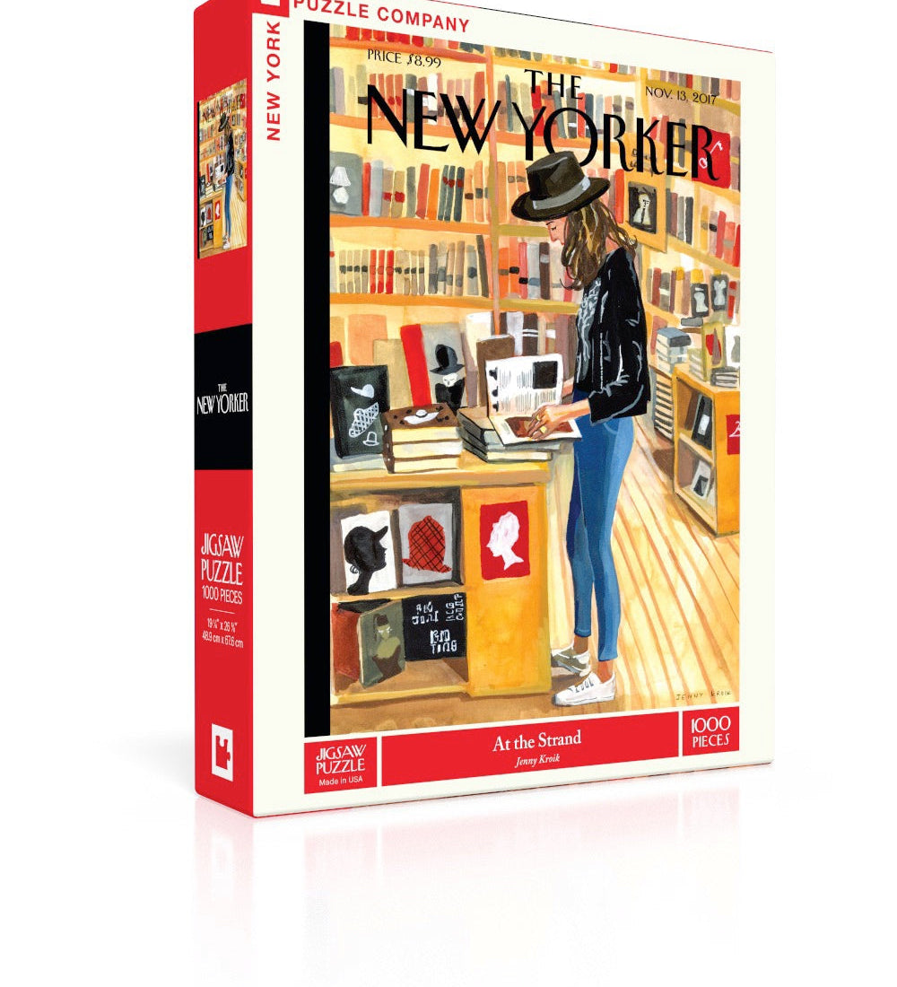 New York Puzzle Co At The Strand 1000 piece jigsaw puzzle featuring an illustrated bookstore scene available at Be Charmed