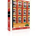 New York Puzzle Co Hot Dogs 1000 piece jigsaw puzzle featuring an illustrated apartment window scene of dogs available at Be Charmed