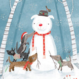 Pictura Snow Dog Christmas card featuring four dogs making a dog-shaped snowman in the forest available at Be Charmed