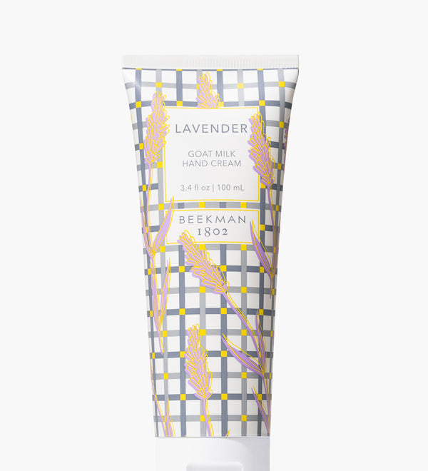 A tube of Beekman 1802 hand lotion with a floral pattern design. Available at Be Charmed