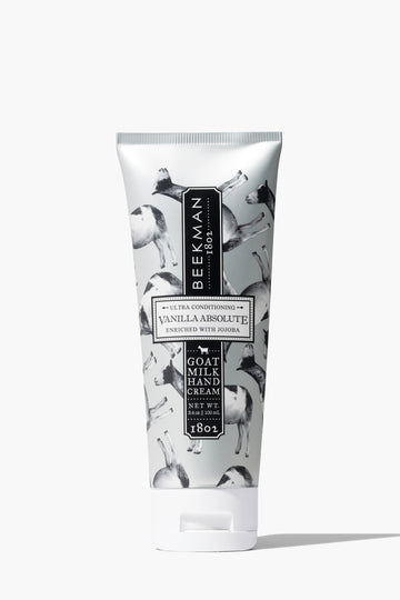 Vanilla Absolute Beekman 1802 Goat Milk Hand Lotion in a 12.5oz bottle, featuring a blend of goat milk, shea butter, and jojoba oil for deep hydration, available at Be Charmed 