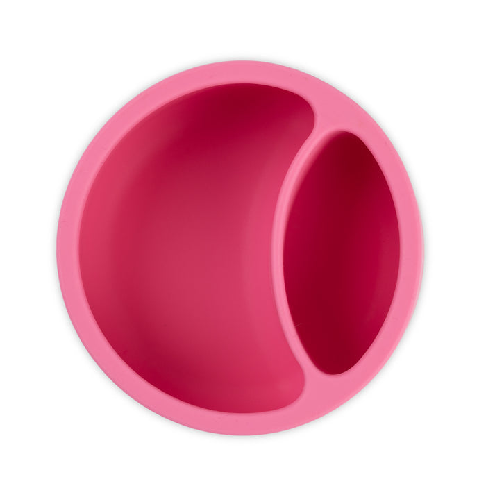 Overhead view of Bella Tunno Miss Mess Wonder Bowl in pink, featuring a suction base and curved lip, available at Be Charmed.