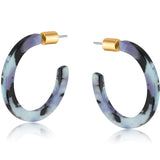 Big Metal London Resin Skinny Sylvia Lilac Earrings – pastel lilac resin hoops with gold-tone accents, handmade and hypoallergenic – Available at Be Charmed