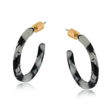 Big Metal London Hortense thin resin hoop earrings in black‑grey‑white marbled resin, approx. 2.8 cm diameter, hypoallergenic surgical steel posts, ultra‑lightweight sustainable earrings. Available at Be Charmed