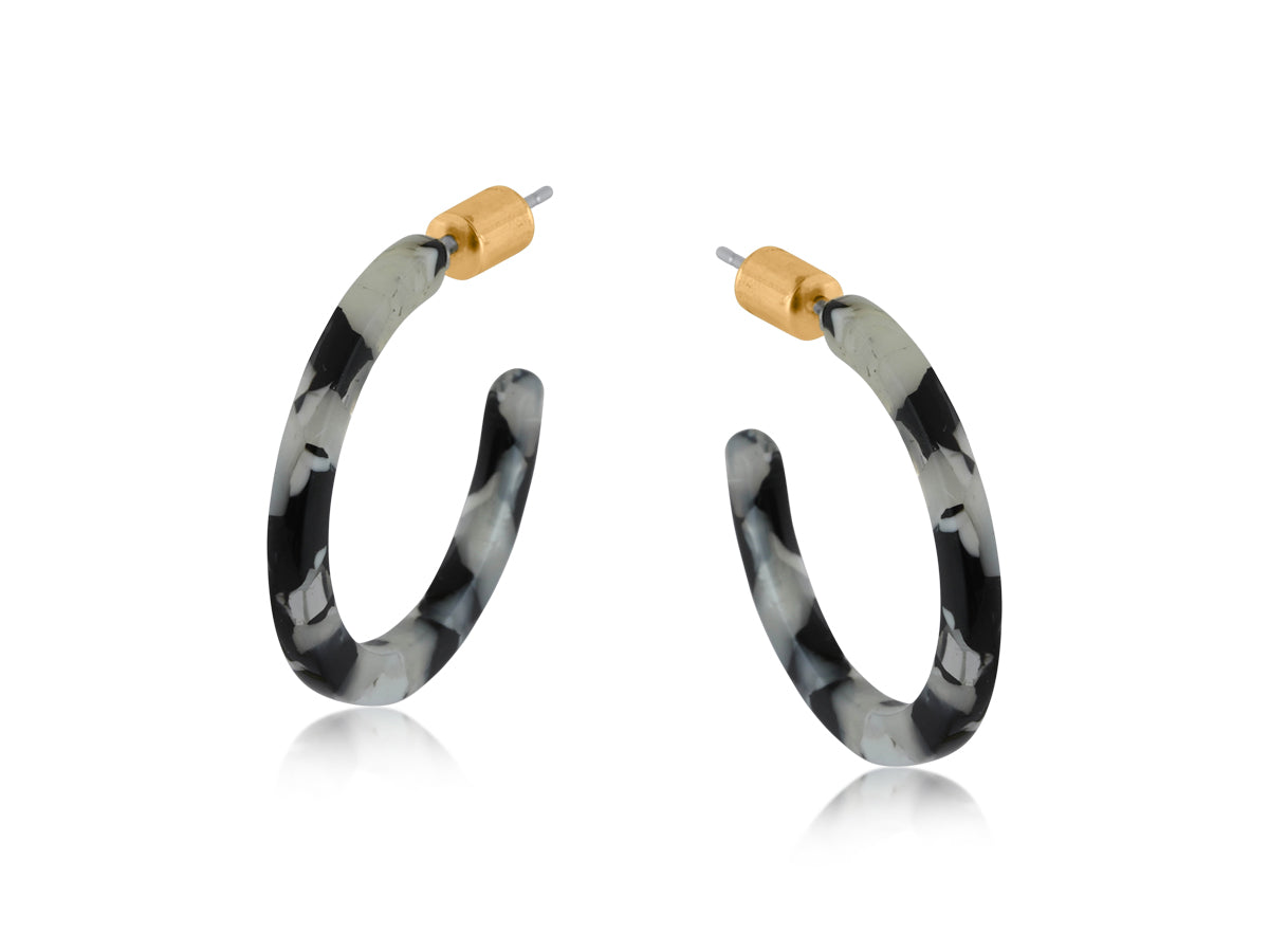 Big Metal London Hortense thin resin hoop earrings in black‑grey‑white marbled resin, approx. 2.8 cm diameter, hypoallergenic surgical steel posts, ultra‑lightweight sustainable earrings. Available at Be Charmed