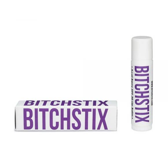 Acai Berry Bitchstix lip balm packaging on a white background. Available at Be Charmed