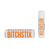 Citrus Orange Bitchstix lip balm with packaging on a white background. Available at Be Charmed