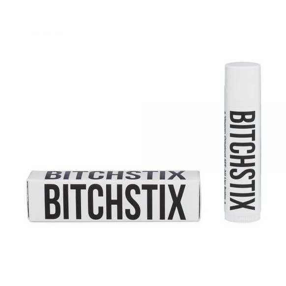 Original Bitchstix lip balm packaging on a white background. Available at Be Charmed