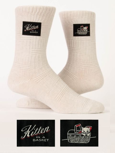 Kitten in a Basket tag socks – soft ankle socks with a playful kitten design, available at Be Charmed.