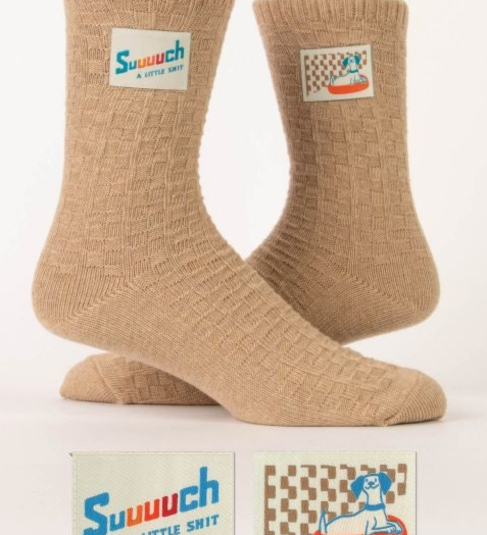 Blue Q "Such A Little Shit" Tag Socks featuring a humorous tag design, available at Be Charmed.