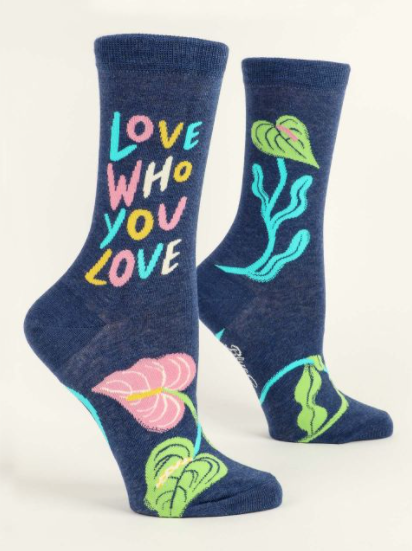 Blue Q "Love Who You Love" Crew Socks featuring a colorful design and positive message, available at Be Charmed.