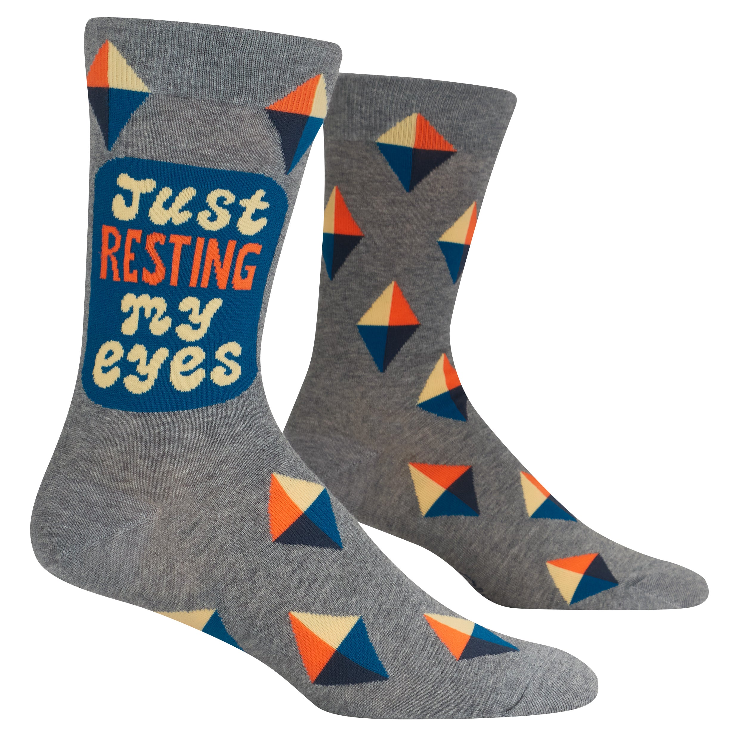 Gray socks with geometric pattern and 'Just Resting My Eyes' text on a white background. Available at Be Charmed