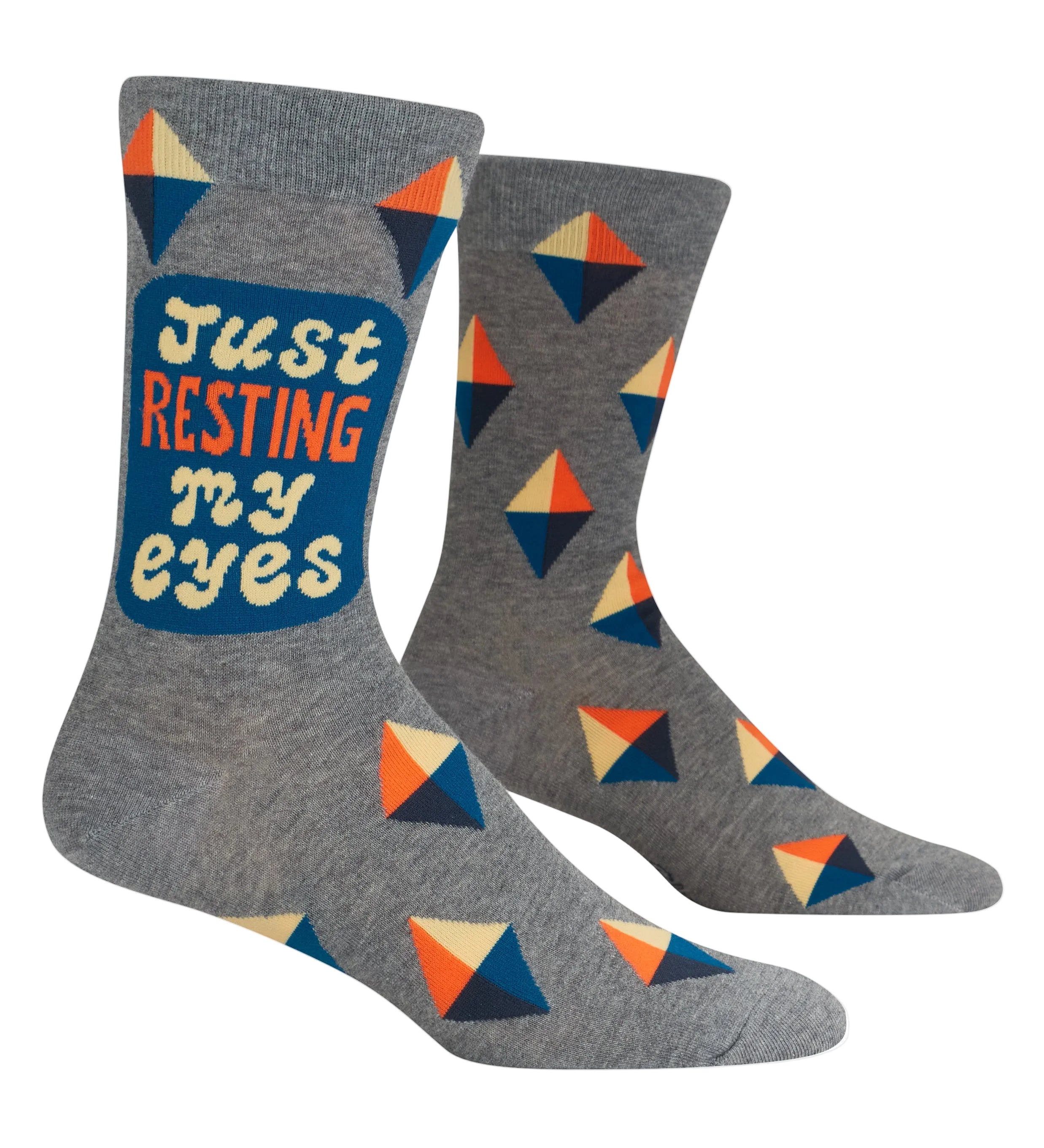 Gray socks with geometric pattern and 'Just Resting My Eyes' text on a white background. Available at Be Charmed
