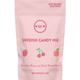 Pink package of Swedish candy mix with BBK branding on a white background. Available at Be Charmed