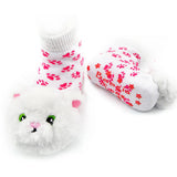 White socks with pink paw prints and cat face design on a white background. Available at Be Charmed