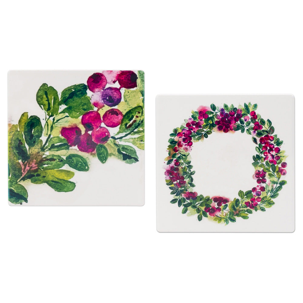 Two square coasters with floral designs on a white background. Sold individually. Available at Be Charmed. 
