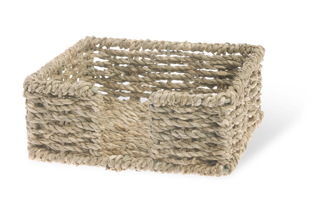 Woven basket made of natural fibers on a white background. Available at Be Charmed
