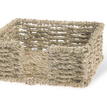 Woven basket made of natural fibers on a white background. Available at Be Charmed