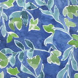 Napkins with a pattern of green leaves on a blue background. Available at Be Charmed