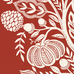 Decorative paper napkin with white pumpkins, leaves, and acorns on a red background. Available at Be Charmed