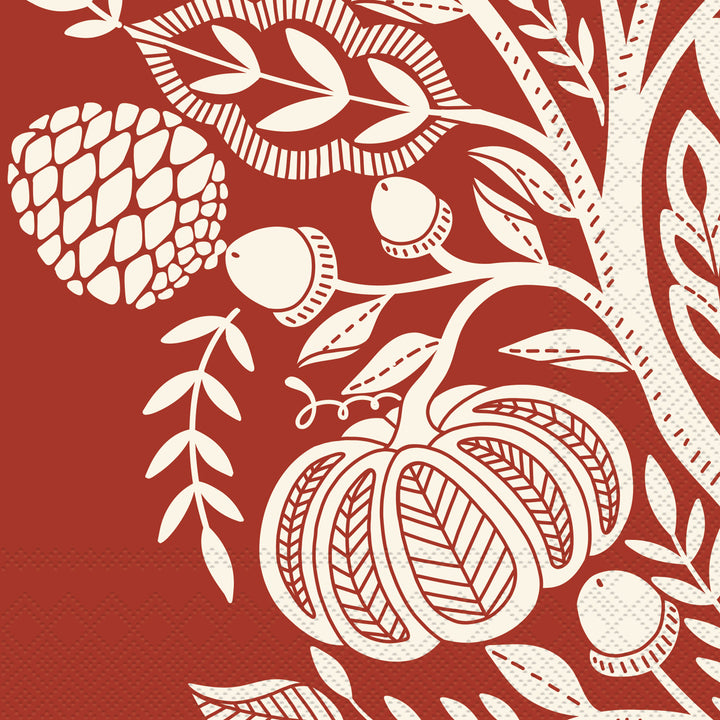Decorative paper napkin with white pumpkins, leaves, and acorns on a red background. Available at Be Charmed