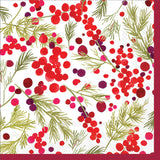 A cocktail napkin with a Christmas-themed design featuring red and green berries and holly leaves on a white background. Be Charmed