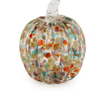 Glass pumpkin with multicolored speckles on a white background. Available at Be Charmed